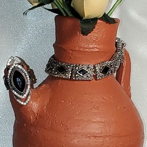 Silver toned hinged bracelet with stretchy ring